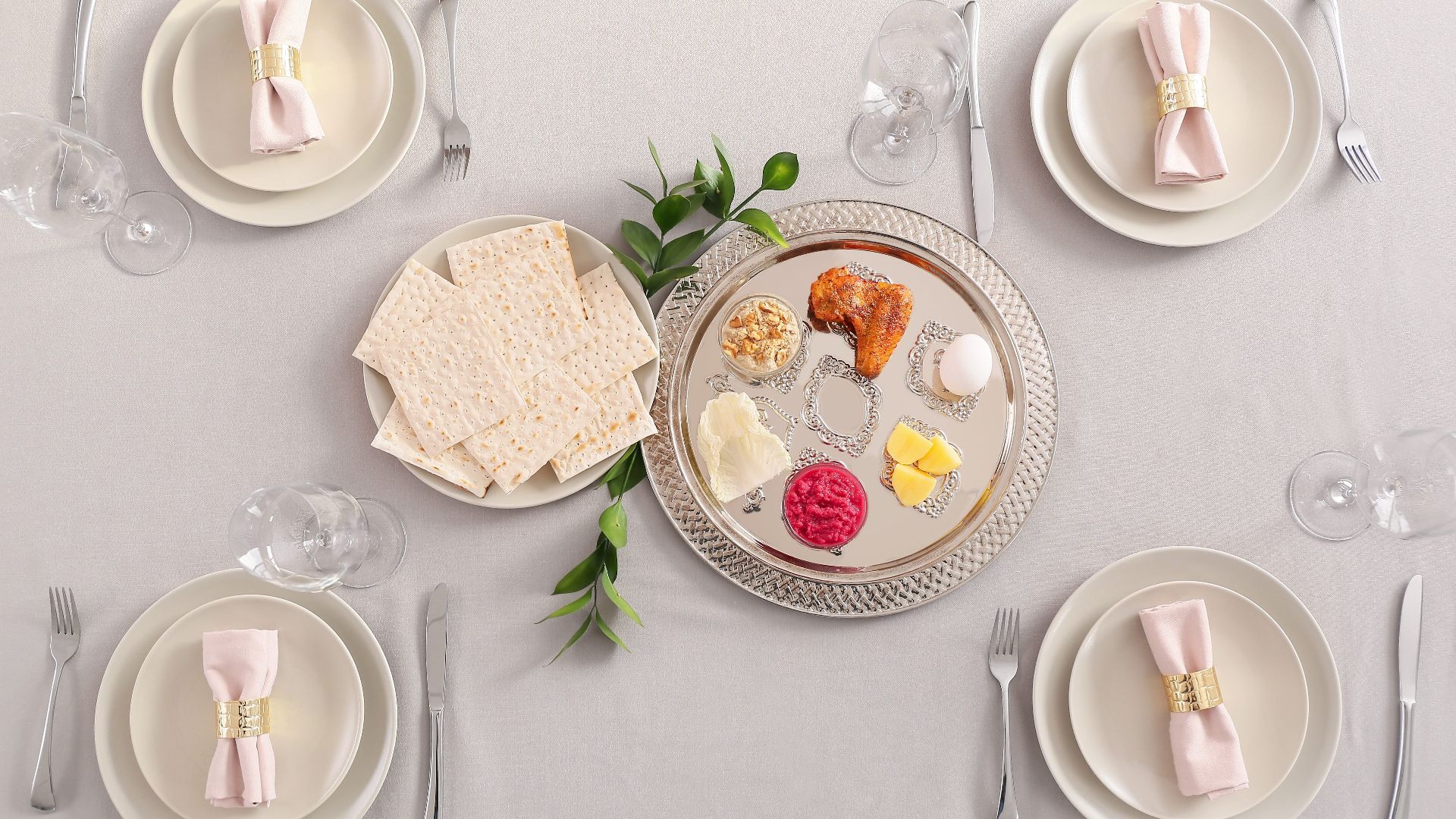 Passover Seder plate with traditional food on served table